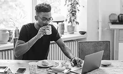 Man with a laptop and a cup of coffee