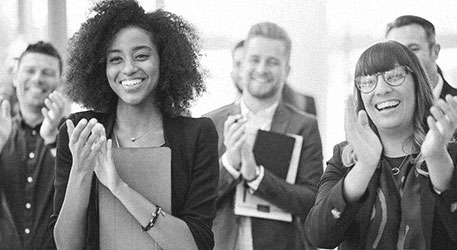 Group of happy workers smiling and clapping workforce development